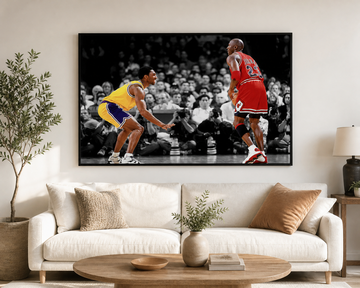 Kobe Bryant defends against Michael Jordan framed wall art print in a living room